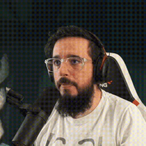 Man With Beard Glasses Headphones Saying NG