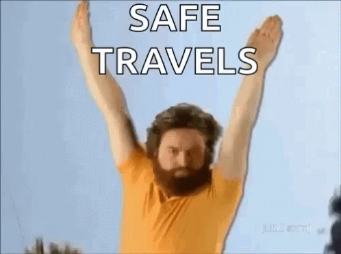 Man With Beard Holding Arms Up Safe Travels