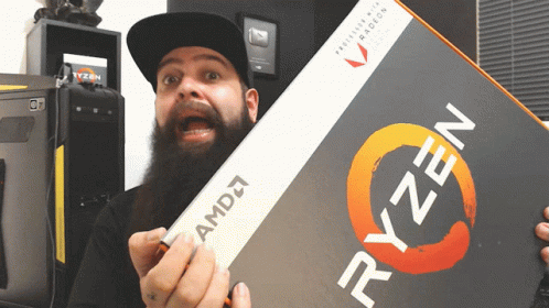 Man With Beard Holding Box of Ryzen Processors