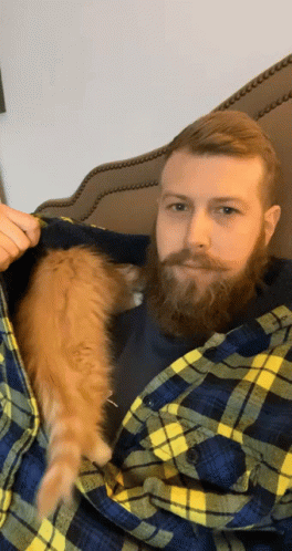 Man With Beard Holding Cat