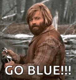 Man With Beard Holding Fishing Rod Saying Go Blue