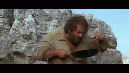 Man with Beard Holding Frying Pan