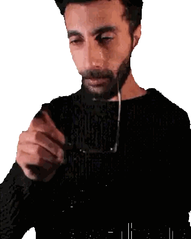 Man With Beard Holding Glasses
