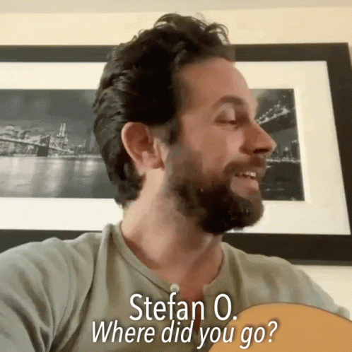 Man with Beard Holding Guitar