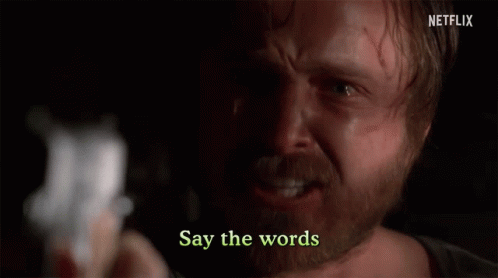 Man with Beard Holding Gun Say Words