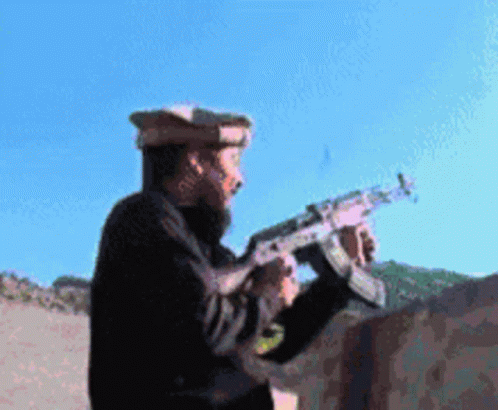 Man With Beard Holding Gun GIF