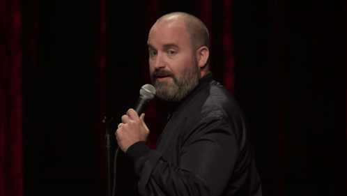 Man with Beard Holding Microphone