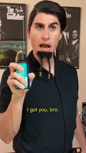Man with Beard Holding Mouthwash