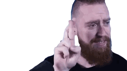 Man With Beard Holding Small Object