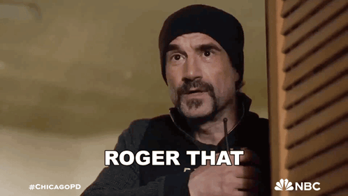 Man With Beard Holding Walkie Talkie Saying Roger That