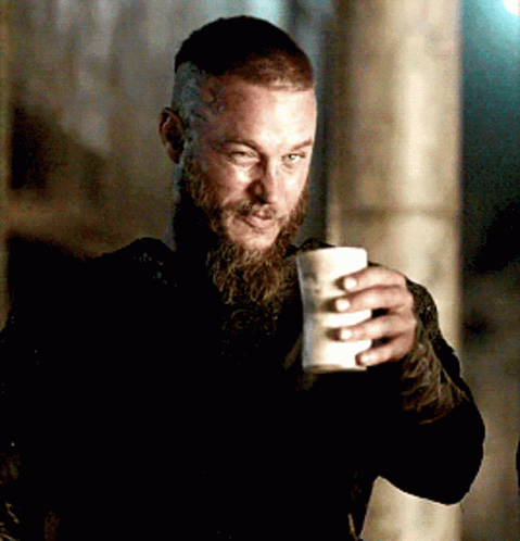 Man With Beard Holding White Cup