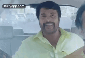 Man With Beard in Back Seat of Car