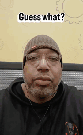 Man With Beard In Beanie And Headphones Says Guess What GIF