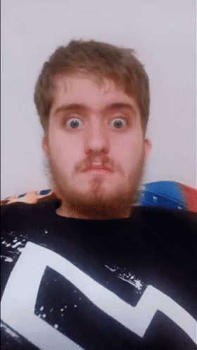 Man With Beard In Black And White Shirt With Letter L GIF