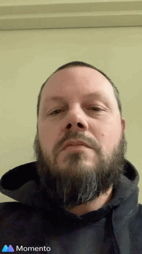 Man with Beard in Black Hoodie