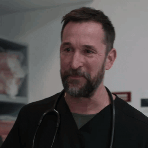 Man With Beard in Black Scrub and Stethoscope