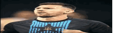 Man with Beard in Black Shirt and Blue Stripe