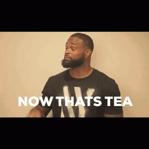 Man With Beard in Black Shirt Saying Now Thats Tea