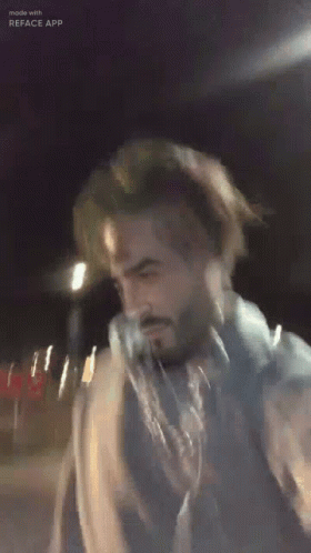 Man With Beard in Blue Jacket and Scarf
