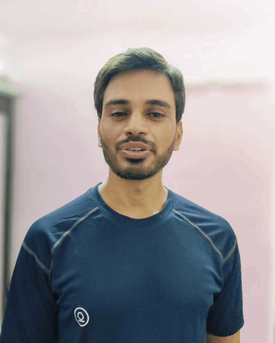 Man with Beard in Blue Shirt and Q