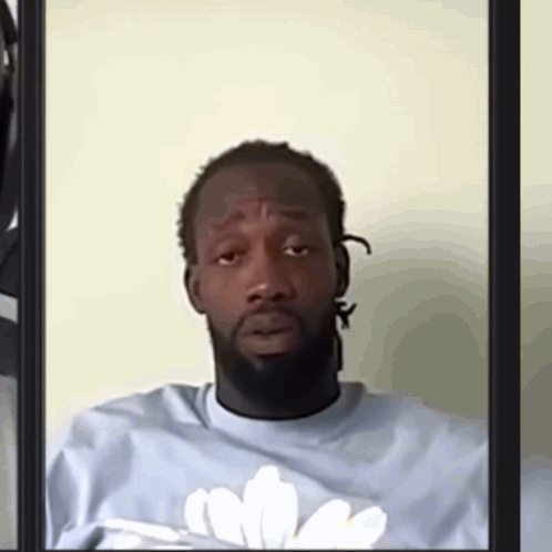 Man With Beard In Blue Shirt And White Flower GIF