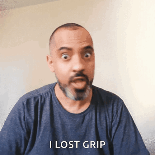 Man With Beard in Blue Shirt Saying I Lost Grip