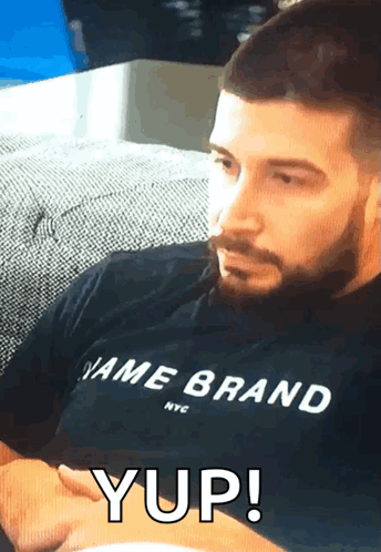 Man with Beard in Brand Shirt