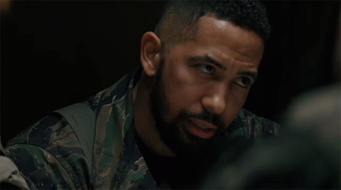 Man with Beard in Camouflage Shirt