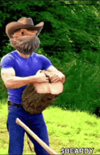 Man With Beard in Cowboy Hat Holding Large Log
