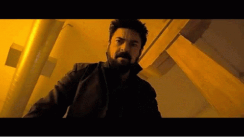 Man with Beard in Dark Room with Yellow Lights