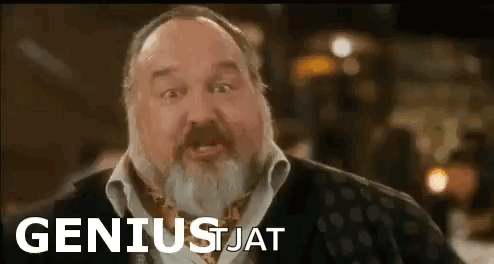 Man With Beard In Front Of Geniusjat Sign GIF