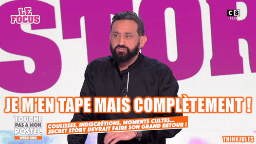 Man With Beard in Front of Le Focus Sign