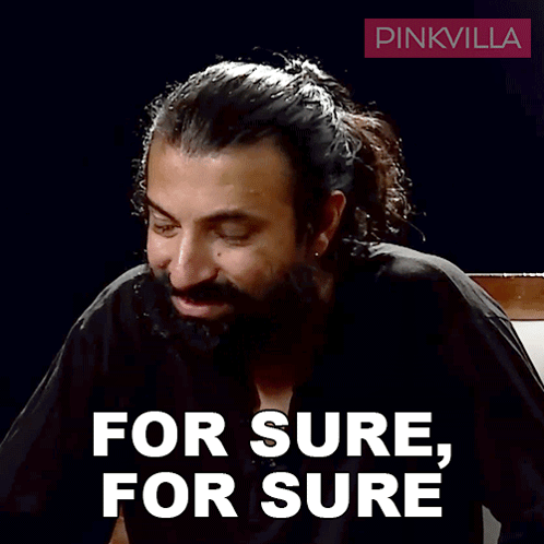 Man With Beard in Front of Pinkvilla Logo