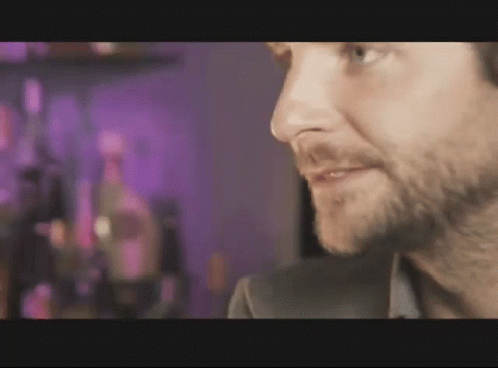 Man With Beard In Front Of Purple Background GIF