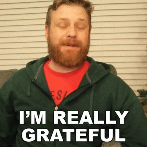 Man with Beard in Green Hoodie and Red Shirt Says Im Really Grateful
