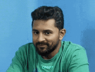 Man with Beard in Green Shirt