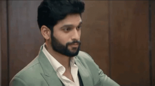 Man With Beard in Green Suit and White Shirt
