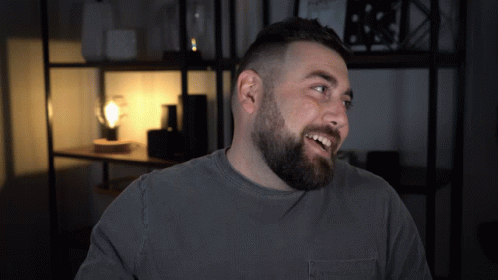 Man With Beard in Grey Shirt With Pocket