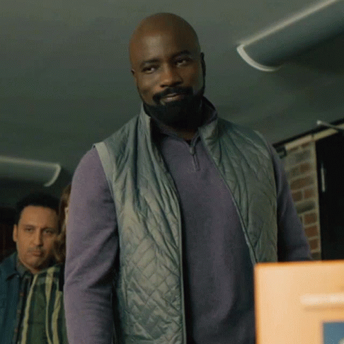 Man with Beard in Grey Vest
