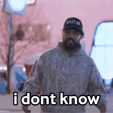 Man With Beard in Hat and Hoodie Says I Don't Know