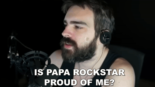Man With Beard in Headphones Saying Papa Rockstar Proud of Me