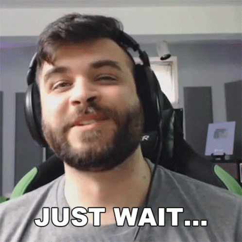 Man With Beard in Headphones Says Just Wait