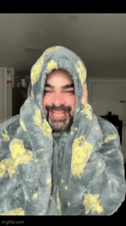 Man with Beard in Hooded Blanket