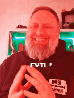 Man With Beard In Hoodie Saying Evil GIF