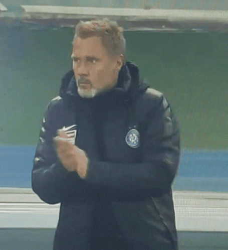 Man with Beard in Nike Jacket Clapping