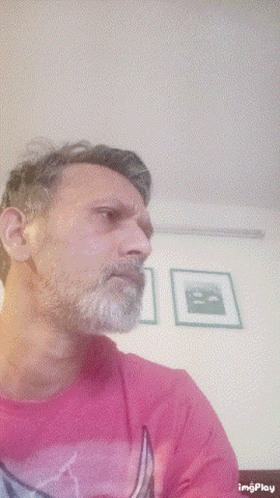 Man with Beard in Pink Shirt with Boat