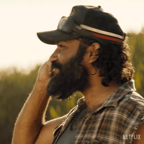 Man With Beard in Plaid Shirt and Netflix Hat
