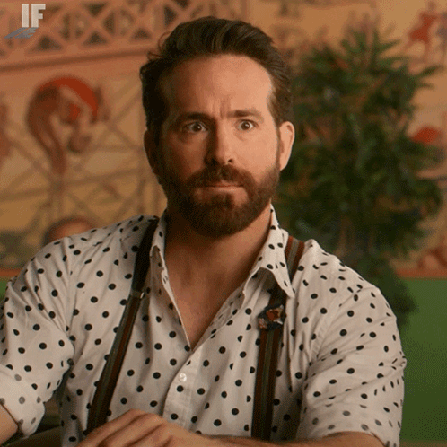Man with Beard in Polka Dot Shirt and Suspenders