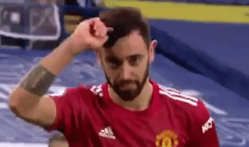 Man with Beard in Red Adidas Shirt