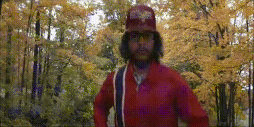Man with Beard in Red Jacket and Hat